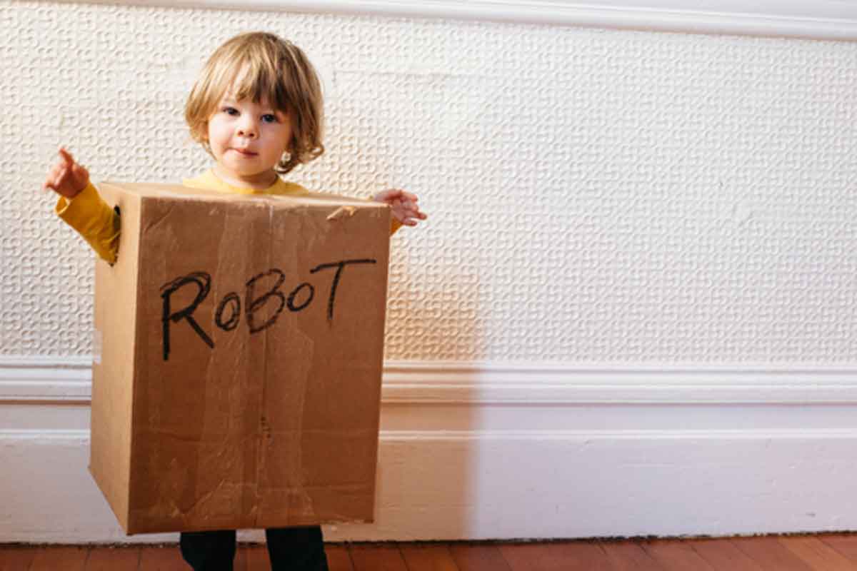 kid in a box labeled robot